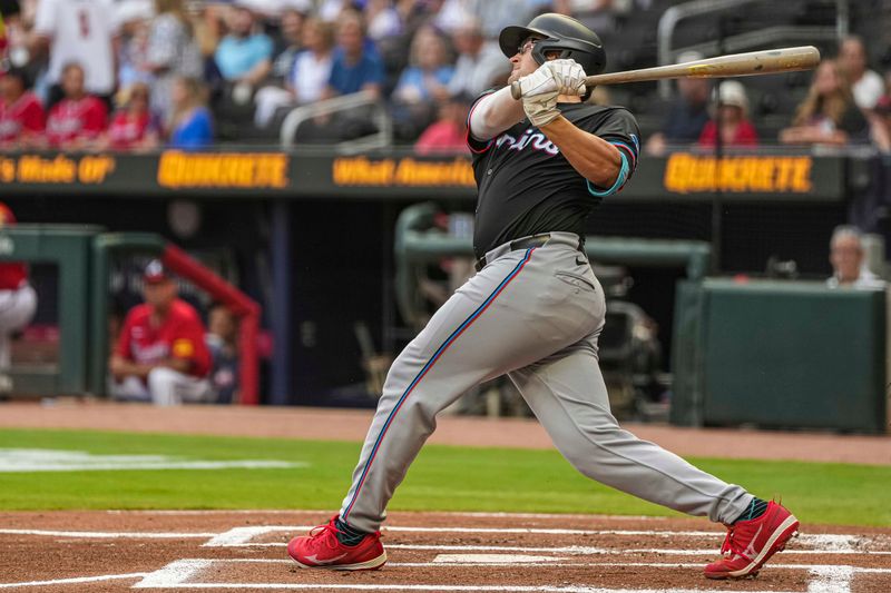 Aug 2, 2024; Cumberland, Georgia, USA; Miami Marlins first baseman Jonah Bride (41) hits a two run home run against the Atlanta Braves during the first inning at Truist Park. Mandatory Credit: Dale Zanine-USA TODAY Sports