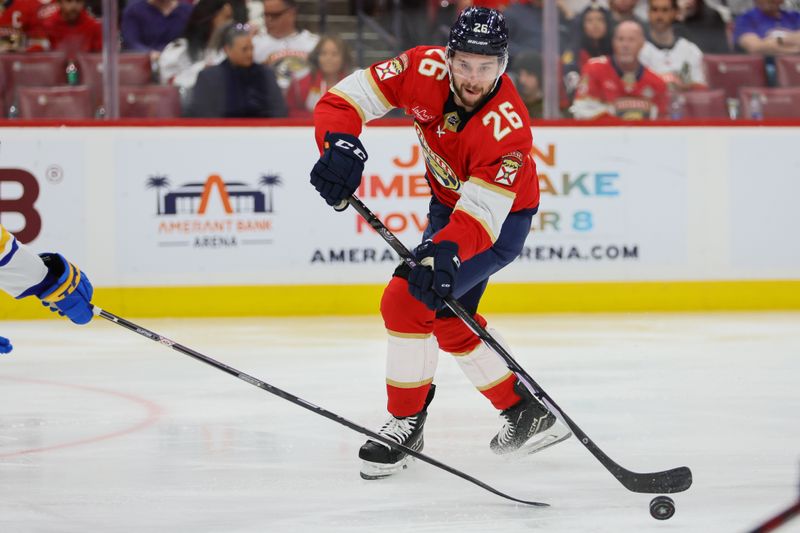 Apr 13, 2024; Sunrise, Florida, USA; Florida Panthers defenseman Uvis Balinskis (26) moves the against the Buffalo Sabres during the second period at Amerant Bank Arena. Mandatory Credit: Sam Navarro-USA TODAY Sports