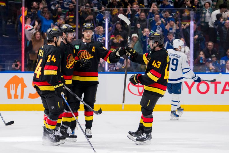 Jan 20, 2024; Vancouver, British Columbia, CAN; Vancouver Canucks forward Pius Suter (24), forward J.T. Miller (9), forward Elias Pettersson (40) and defenseman Quinn Hughes (43) celebrate Miller   s goal against the Toronto Maple Leafs in the third period at Rogers Arena. Canucks won 6-4. Mandatory Credit: Bob Frid-USA TODAY Sports