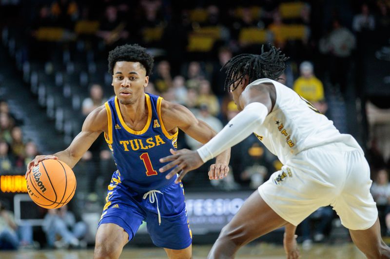 Jan 14, 2023; Wichita, Kansas, USA; Tulsa Golden Hurricane guard Sam Griffin (1) brings the ball up court around Wichita State Shockers guard Jaron Pierre Jr. (5) during the first half at Charles Koch Arena. Mandatory Credit: William Purnell-USA TODAY Sports