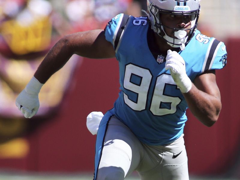 Carolina Panthers defensive end Austin Larkin (96) runs during an NFL preseason football game against the Washington Commanders, Saturday, Aug. 13, 2022 in Landover. (AP Photo/Daniel Kucin Jr.)