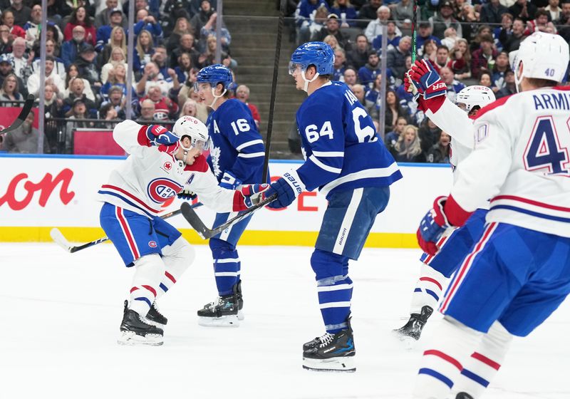 Nov 9, 2024; Toronto, Ontario, CAN; Montreal Canadiens right wing Brendan Gallagher (11) scores a goal and celebrates against the Toronto Maple Leafs during the second period at Scotiabank Arena. Mandatory Credit: Nick Turchiaro-Imagn Images