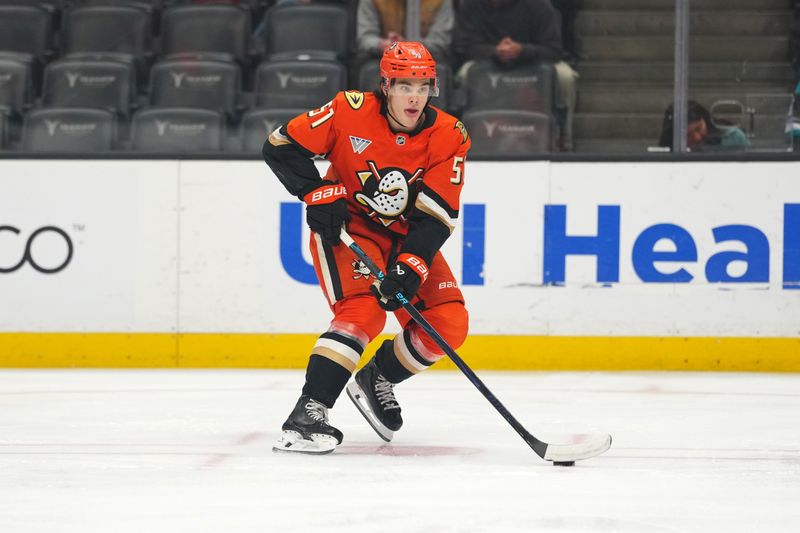 Nov 20, 2025; Anaheim, California, USA; Anaheim Ducks defenseman Olen Zellweger (51) skates with the puck against the Ottawa Senators in the first period at Honda Center. Mandatory Credit: Kirby Lee-Imagn Images