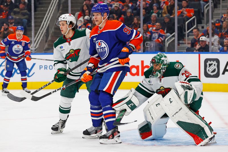 Nov 21, 2024; Edmonton, Alberta, CAN; Edmonton Oilers forward Corey Perry (90) tries to screen Minnesota Wild goaltender Marc-Andre Fleury (29) during the third period at Rogers Place. Mandatory Credit: Perry Nelson-Imagn Images