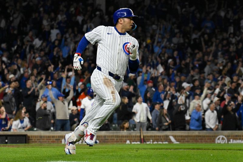 May 12, 2025; Chicago, Illinois, USA;  Chicago Cubs outfielder Seiya Suzuki (27) runs after he hits a two run home run against the Miami Marlins during the fifth inning at Wrigley Field. Mandatory Credit: Matt Marton-Imagn Images