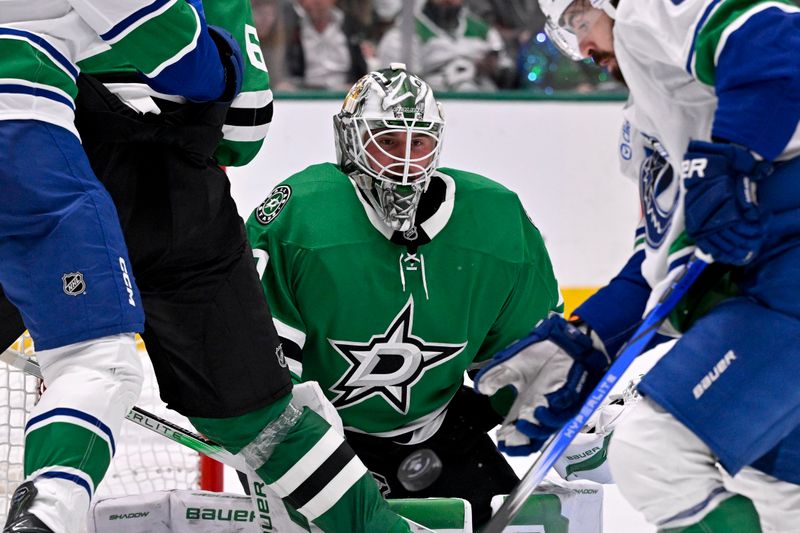 Jan 31, 2025; Dallas, Texas, USA; Dallas Stars goaltender Jake Oettinger (29) faces the Vancouver Canucks attack during the third period at the American Airlines Center. Mandatory Credit: Jerome Miron-Imagn Images