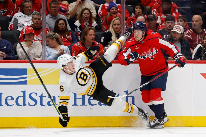 Oct 8, 2025; Washington, District of Columbia, USA; Washington Capitals right wing Ryan Leonard (9) checks Boston Bruins defenseman Mason Lohrei (6) during the third period at Capital One Arena. Mandatory Credit: Geoff Burke-Imagn Images