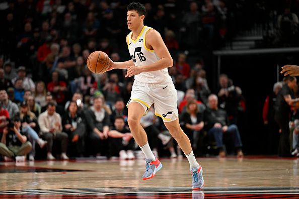 PORTLAND, OREGON - DECEMBER 14: Simone Fontecchio #16 of the Utah Jazz dribbles during the second quarter of the game against the Portland Trail Blazers at Moda Center on December 14, 2023 in Portland, Oregon. NOTE TO USER: User expressly acknowledges and agrees that, by downloading and or using this Photograph, user is consenting to the terms and conditions of the Getty Images License Agreement. (Photo by Alika Jenner/Getty Images)