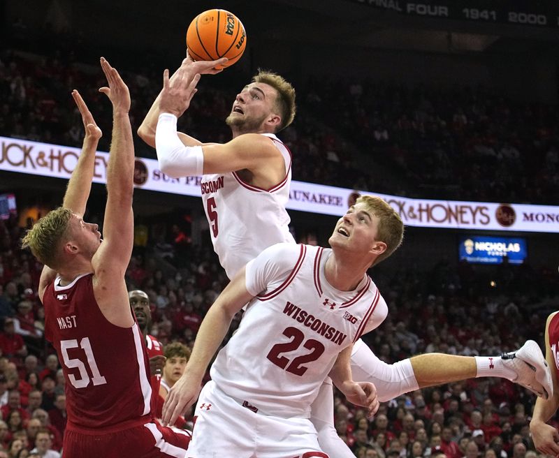 Jan 6, 2024; Madison, Wisconsin, USA; Wisconsin forward Tyler Wahl (5) scores during the second half of their game at Kohl Center. Mandatory Credit: Mark Hoffman-USA TODAY Sports