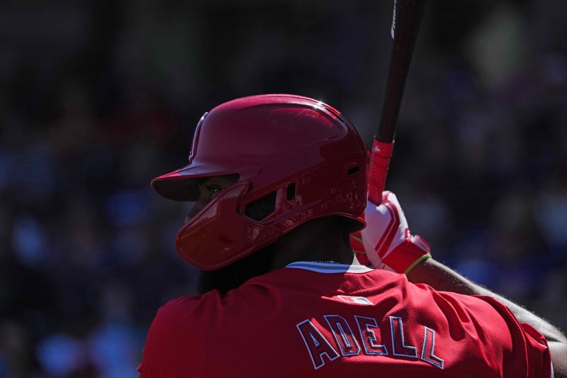 Mar 4, 2024; Surprise, Arizona, USA; Los Angeles Angels right fielder Jo Adell (7) waits on deck against the Texas Rangers during the first inning at Surprise Stadium. Mandatory Credit: Joe Camporeale-USA TODAY Sports