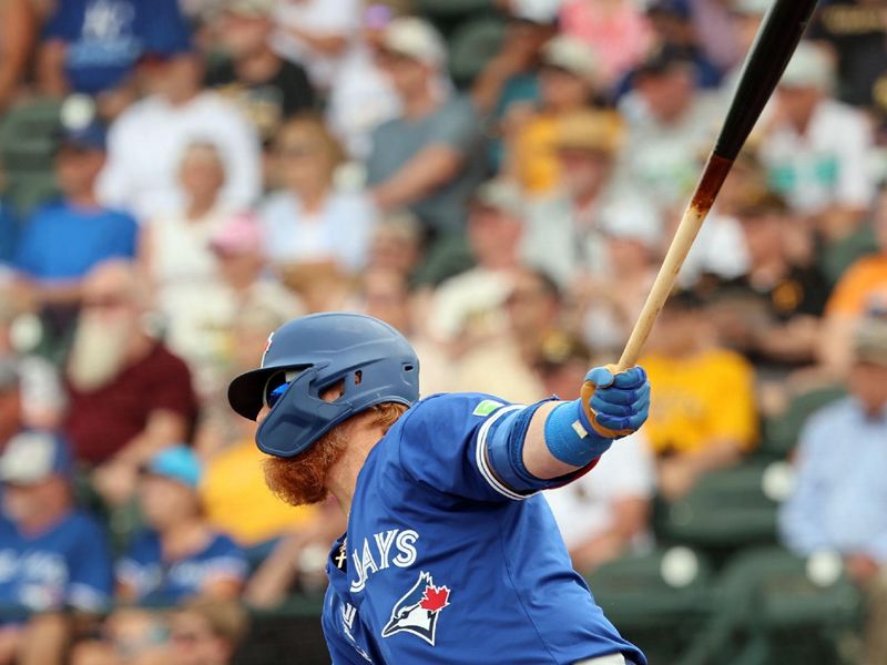 Mar 5, 2024; Bradenton, Florida, USA;  Toronto Blue Jays designated hitter Justin Turner (2)  singles during the fourth inning against the Pittsburgh Pirates at LECOM Park. Mandatory Credit: Kim Klement Neitzel-USA TODAY Sports