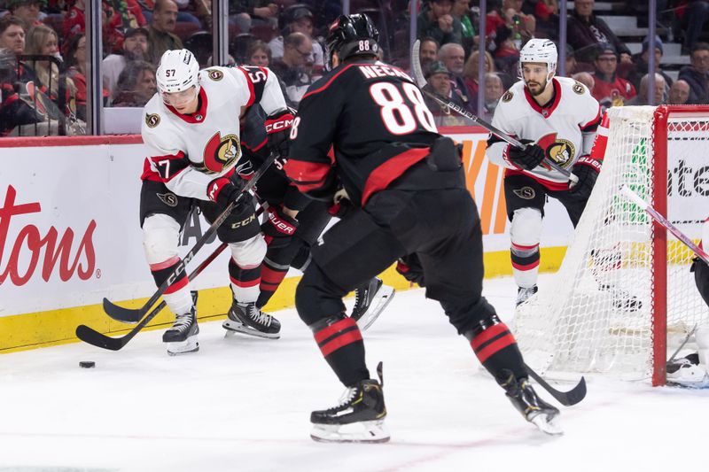 Mar 17, 2024; Ottawa, Ontario, CAN; Ottawa Senators center Shane Pinto (57) controls the puck in the second period against the Carolina Hurricanes at the Canadian Tire Centre. Mandatory Credit: Marc DesRosiers-USA TODAY Sports