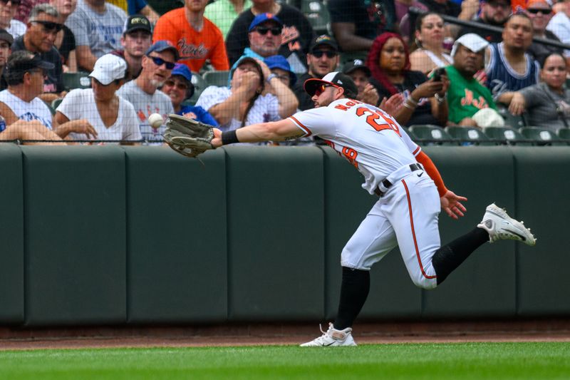 Aug 6, 2023; Baltimore, Maryland, USA; Baltimore Orioles right fielder Ryan McKenna (26) makes a catch in foul territory during the sixth inning against the New York Mets at Oriole Park at Camden Yards. Mandatory Credit: Reggie Hildred-USA TODAY Sports