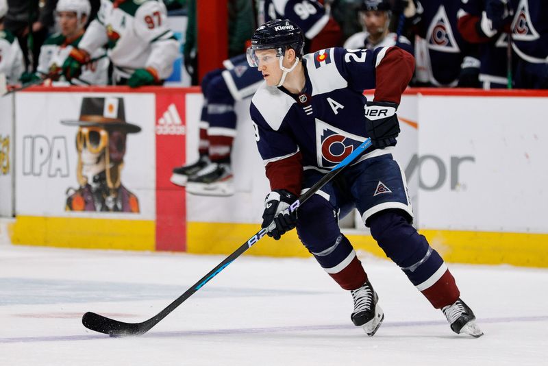 Mar 8, 2024; Denver, Colorado, USA; Colorado Avalanche center Nathan MacKinnon (29) controls the puck in the first period against the Minnesota Wild at Ball Arena. Mandatory Credit: Isaiah J. Downing-USA TODAY Sports