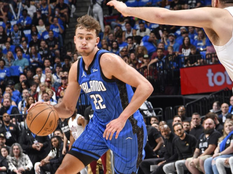 ORLANDO, FL - APRIL 27: Franz Wagner #22 of the Orlando Magic dribbles the ball during the game against the Cleveland Cavaliers during Round 1 Game 4 of the 2024 NBA Playoffs on April 27, 2024 at the Kia Center in Orlando, Florida. NOTE TO USER: User expressly acknowledges and agrees that, by downloading and or using this photograph, User is consenting to the terms and conditions of the Getty Images License Agreement. Mandatory Copyright Notice: Copyright 2024 NBAE (Photo by Fernando Medina/NBAE via Getty Images)