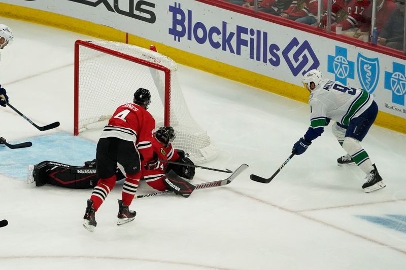 Oct 22, 2024; Chicago, Illinois, USA; Vancouver Canucks center J.T. Miller (9) shoots the puck on Chicago Blackhawks goaltender Petr Mrazek (34) during the first period at United Center. Mandatory Credit: David Banks-Imagn Images