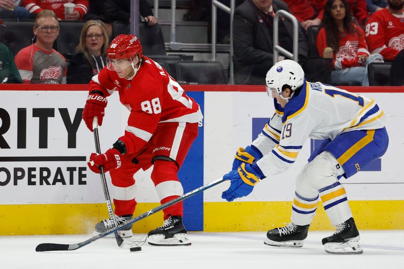 Apr 7, 2024; Detroit, Michigan, USA; Detroit Red Wings right wing Patrick Kane (88) skates with the puck chased by Buffalo Sabres center Peyton Krebs (19) in the second period at Little Caesars Arena. Mandatory Credit: Rick Osentoski-USA TODAY Sports