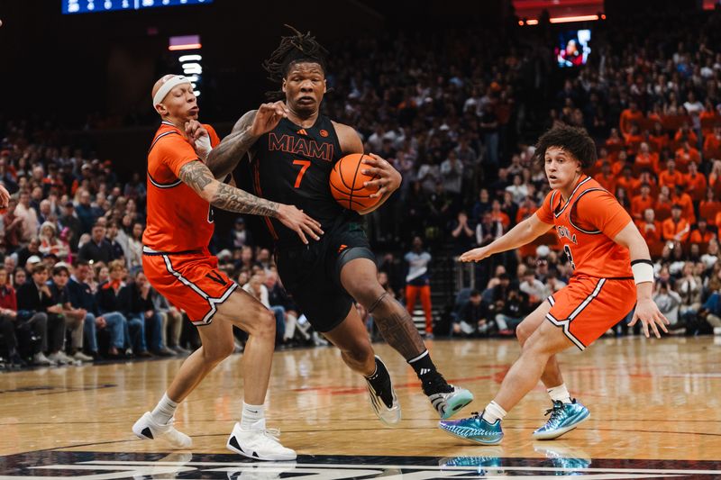 Feb 21, 2026; Charlottesville, Virginia, USA; Miami (FL) Hurricanes forward Shelton Henderson (7) controls the ball while Virginia Cavaliers guard Jacari White (6) defends during the first half at John Paul Jones Arena. Mandatory Credit: Emily Faith Morgan-Imagn Images