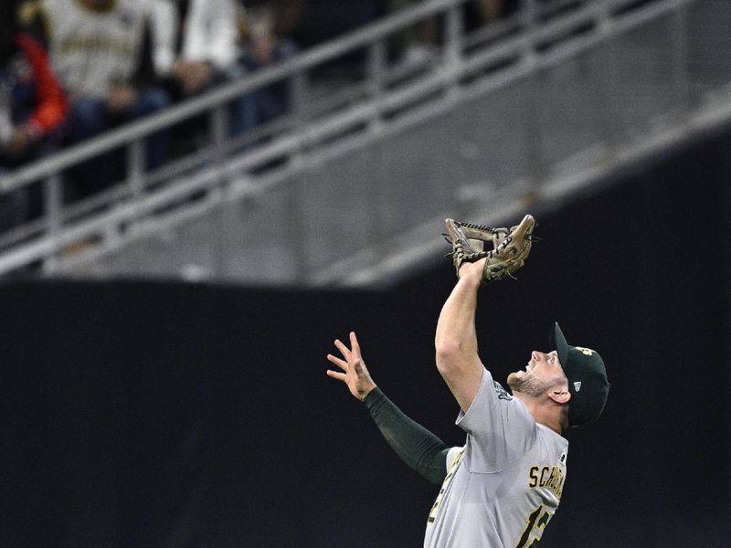 Jun 11, 2024; San Diego, California, USA; Oakland Athletics shortstop Max Schuemann (12) catches a pop-up hit by San Diego Padres first baseman Luis Arraez (not pictured) during the seventh inning at Petco Park. Mandatory Credit: Orlando Ramirez-USA TODAY Sports