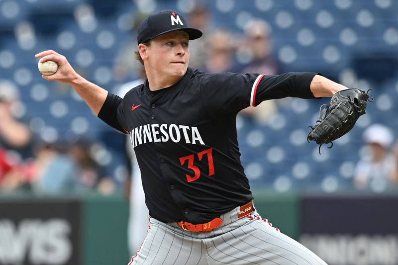 May 1, 2025; Cleveland, Ohio, USA; Minnesota Twins relief pitcher Louis Varland (37) throws a pitch during the seventh inning against the Cleveland Guardians at Progressive Field. Mandatory Credit: Ken Blaze-Imagn Images

