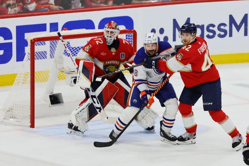 Jun 18, 2024; Sunrise, Florida, USA; Florida Panthers defenseman Gustav Forsling (42) and goaltender Sergei Bobrovsky (72) defend against Edmonton Oilers forward Zach Hyman (18) during the second period in game five of the 2024 Stanley Cup Final at Amerant Bank Arena. Mandatory Credit: Sam Navarro-USA TODAY Sports