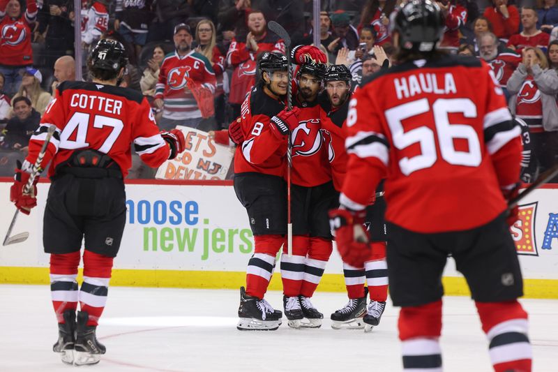 Nov 7, 2024; Newark, New Jersey, USA; New Jersey Devils defenseman Jonas Siegenthaler (71) celebrates his goal against the Montreal Canadiens during the second period at Prudential Center. Mandatory Credit: Ed Mulholland-Imagn Images