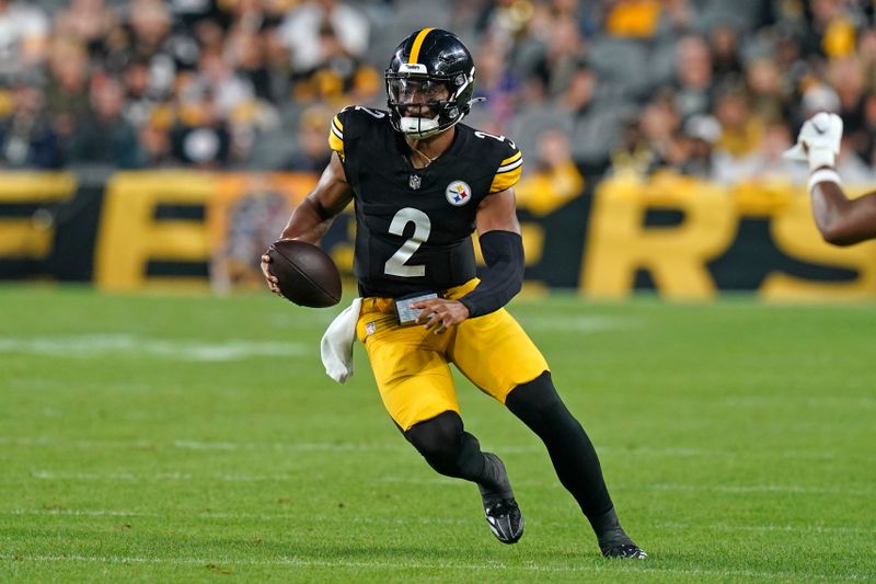 Pittsburgh Steelers quarterback Justin Fields (2) runs with the ball during the first half of an NFL preseason football game against the Buffalo Bills, Saturday, Aug. 17, 2024, in Pittsburgh. (AP Photo/Matt Freed)