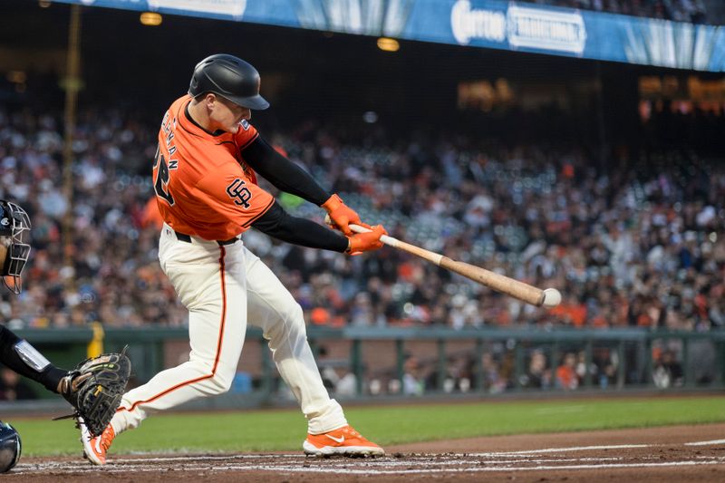 Apr 19, 2024; San Francisco, California, USA;  San Francisco Giants third base Matt Chapman (26) hits a double against the Arizona Diamondbacks during the second inning at Oracle Park. Mandatory Credit: John Hefti-USA TODAY Sports