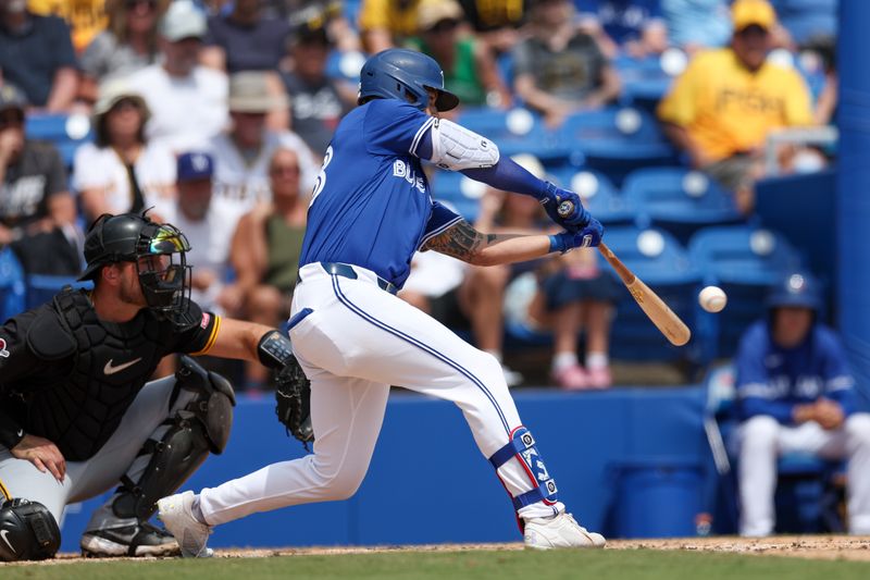 Mar 23, 2025; Dunedin, Florida, USA; Toronto Blue Jays outfielder Nathan Lukes (38) hits an rbi single against the Pittsburgh Pirates in the third inning during spring training at TD Ballpark. Mandatory Credit: Nathan Ray Seebeck-Imagn Images