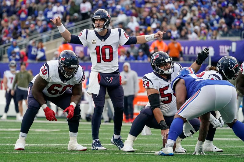 Houston Texans quarterback Davis Mills (10) calls an audible at the line of scrimmage against the New York Giants during the fourth quarter of an NFL football game, Sunday, Nov. 13, 2022, in East Rutherford, N.J. (AP Photo/John Minchillo)