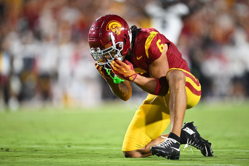 Sep 7, 2024; Los Angeles, California, USA; USC Trojans wide receiver Makai Lemon (6) reacts after missing a catch in the end zone against the Utah State Aggies during the second quarter at United Airlines Field at Los Angeles Memorial Coliseum. Mandatory Credit: Jonathan Hui-Imagn Images