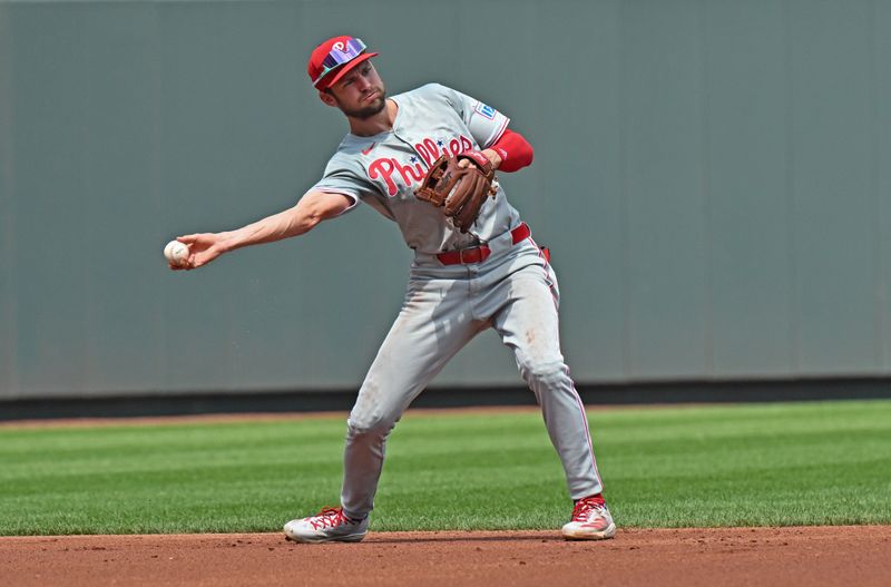 Aug 25, 2024; Kansas City, Missouri, USA;  Philadelphia Phillies shortstop Trea Turner (7) throws to second base for an out in the first inning against the Kansas City Royals at Kauffman Stadium. Mandatory Credit: Peter Aiken-USA TODAY Sports