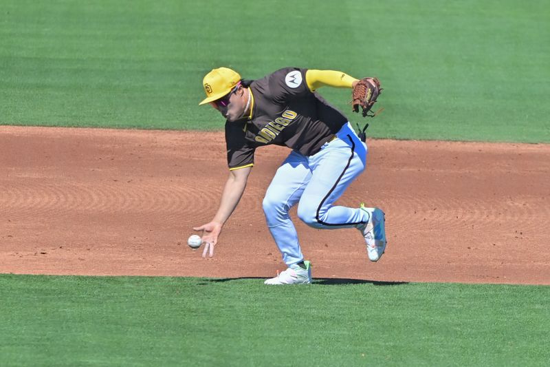 Mar 1, 2024; Peoria, Arizona, USA; San Diego Padres third baseman Eguy Rosario (5) fields a ball in the second inning against the Los Angeles Angels during a spring training game at Peoria Sports Complex. Mandatory Credit: Matt Kartozian-USA TODAY Sports