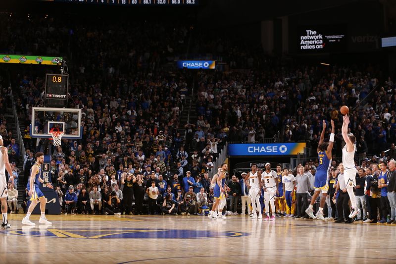 SAN FRANCISCO, CA - JANUARY 4: Nikola Jokic #15 of the Denver Nuggets shoots the game winner three point basket during the game against the Golden State Warriors on January 4, 2024 at Chase Center in San Francisco, California. NOTE TO USER: User expressly acknowledges and agrees that, by downloading and or using this photograph, user is consenting to the terms and conditions of Getty Images License Agreement. Mandatory Copyright Notice: Copyright 2024 NBAE (Photo by Jed Jacobsohn/NBAE via Getty Images)