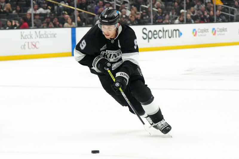 Nov 2, 2024; Los Angeles, California, USA; LA Kings right wing Adrian Kempe (9) skates with the puck against the Chicago Blackhawks in the third period at Crypto.com Arena. Mandatory Credit: Kirby Lee-Imagn Images