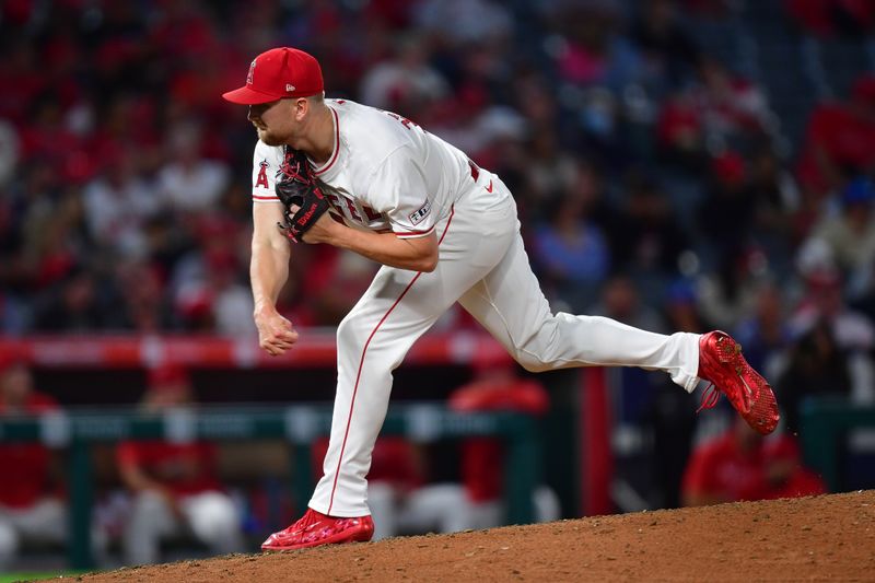 Sep 13, 2024; Anaheim, California, USA; Los Angeles Angels pitcher Ryan Zeferjahn (56) throws against the Houston Astros during the eighth inning at Angel Stadium. Mandatory Credit: Gary A. Vasquez-Imagn Images