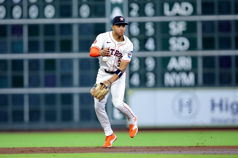Apr 30, 2025; Houston, Texas, USA; Houston Astros shortstop Jeremy Pena (3) attempts to field a batted ball against the Detroit Tigers during the third inning at Daikin Park. Mandatory Credit: Erik Williams-Imagn Images