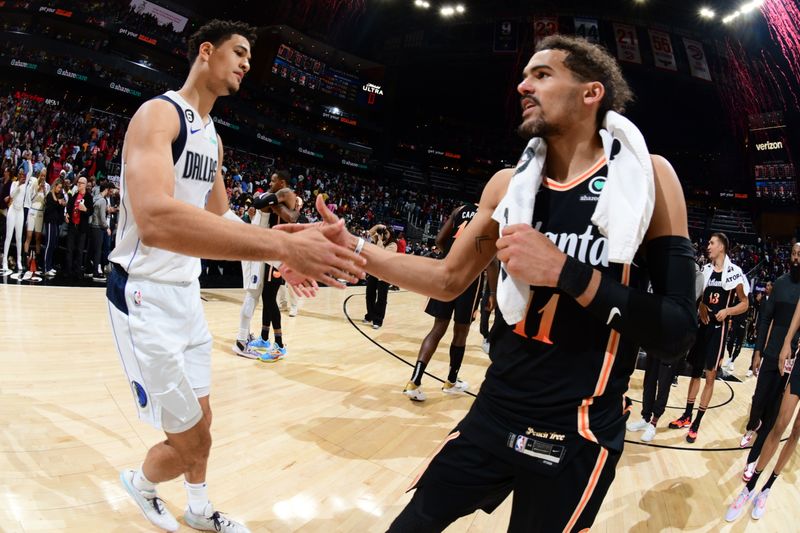 ATLANTA, GA - APRIL 2: Josh Green #8 of the Dallas Mavericks and Trae Young #11 of the Atlanta Hawks after the game on April 2, 2023 at State Farm Arena in Atlanta, Georgia.  NOTE TO USER: User expressly acknowledges and agrees that, by downloading and/or using this Photograph, user is consenting to the terms and conditions of the Getty Images License Agreement. Mandatory Copyright Notice: Copyright 2023 NBAE (Photo by Scott Cunningham/NBAE via Getty Images)