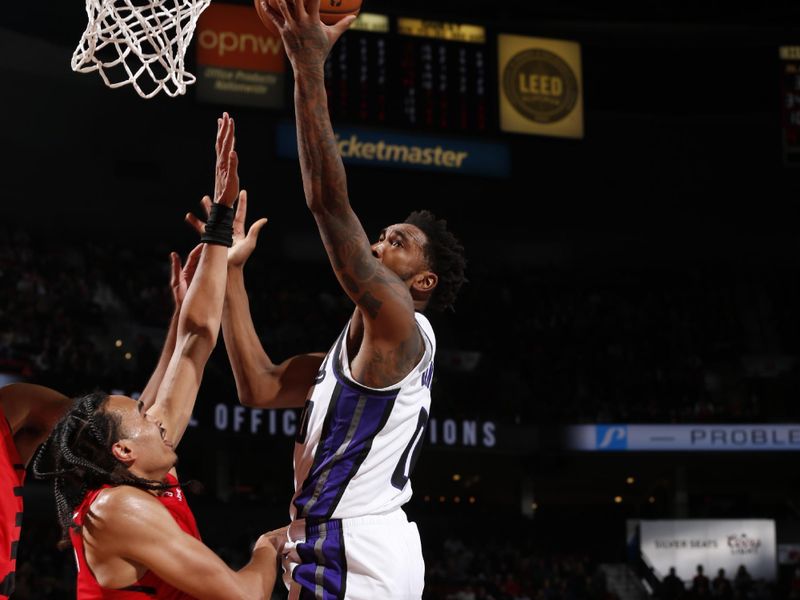 PORTLAND, OR - NOVEMBER 29: Malik Monk #0 of the Sacramento Kings drives to the basket during the game against the Portland Trail Blazers during the Emirates NBA Cup on November 29, 2024 at the Moda Center Arena in Portland, Oregon. NOTE TO USER: User expressly acknowledges and agrees that, by downloading and or using this photograph, user is consenting to the terms and conditions of the Getty Images License Agreement. Mandatory Copyright Notice: Copyright 2024 NBAE (Photo by Cameron Browne/NBAE via Getty Images)