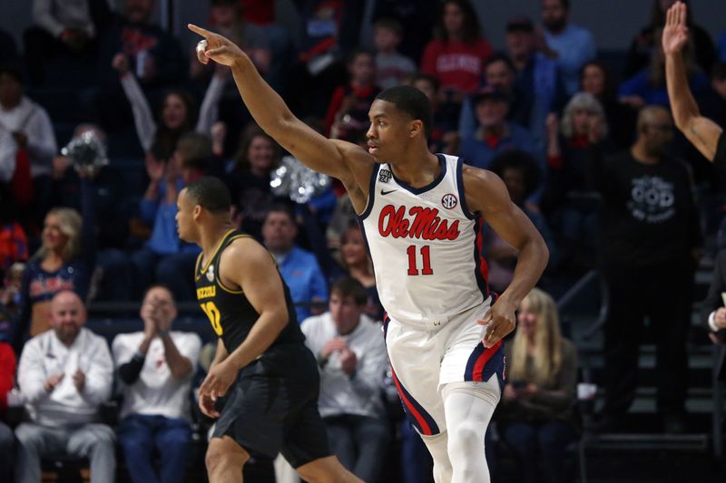 Feb 17, 2024; Oxford, Mississippi, USA; Mississippi Rebels guard Matthew Murrell (11) reacts after a three point basket during the first half against the Missouri Tigers at The Sandy and John Black Pavilion at Ole Miss. Mandatory Credit: Petre Thomas-USA TODAY Sports