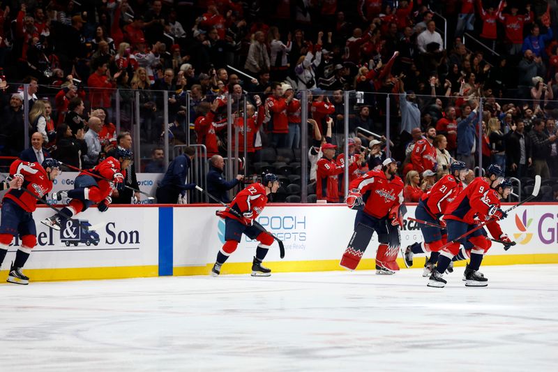 Nov 5, 2025; Washington, District of Columbia, USA; Washington Capitals players jump off the bench in celebration after Capitals left wing Alex Ovechkin (not pictured) after scores his 900th NHL goal, against the St. Louis Blues, during the second period at Capital One Arena. Mandatory Credit: Geoff Burke-Imagn Images
