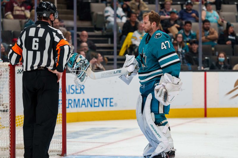 Jan 18, 2023; San Jose, California, USA;  San Jose Sharks goaltender James Reimer (47) retrieves his helmet from the ice during the third period against the Dallas Stars at SAP Center at San Jose. Mandatory Credit: Neville E. Guard-USA TODAY Sports