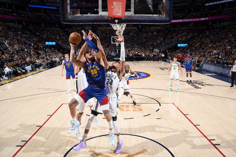 DENVER, CO - MARCH 25: Aaron Gordon #50 of the Denver Nuggets shoots the ball during the game against the Milwaukee Bucks on March 25, 2023 at the Ball Arena in Denver, Colorado. NOTE TO USER: User expressly acknowledges and agrees that, by downloading and/or using this Photograph, user is consenting to the terms and conditions of the Getty Images License Agreement. Mandatory Copyright Notice: Copyright 2023 NBAE (Photo by Garrett Ellwood/NBAE via Getty Images)