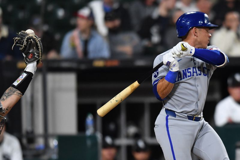 Apr 15, 2024; Chicago, Illinois, USA; Kansas City Royals catcher Freddy Fermin (34) avoids getting hit by a pitch during the eighth inning against the Chicago White Sox at Guaranteed Rate Field. Mandatory Credit: Patrick Gorski-USA TODAY Sports