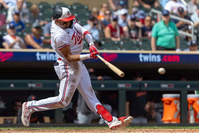 Aug 16, 2023; Minneapolis, Minnesota, USA; Minnesota Twins third baseman Royce Lewis (23) hits a single against the Detroit Tigers in the ninth inning at Target Field. Mandatory Credit: Jesse Johnson-USA TODAY Sports