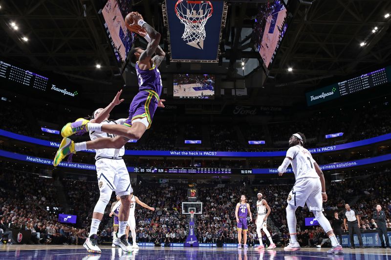 SALT LAKE CITY, UT - JANUARY 10: John Collins #20 of the Utah Jazz dunks the ball during the game against the Denver Nuggets on January 10, 2024 at Delta Center in Salt Lake City, Utah. NOTE TO USER: User expressly acknowledges and agrees that, by downloading and or using this Photograph, User is consenting to the terms and conditions of the Getty Images License Agreement. Mandatory Copyright Notice: Copyright 2024 NBAE (Photo by Melissa Majchrzak/NBAE via Getty Images)