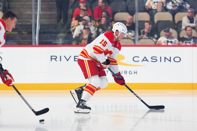 Oct 14, 2023; Pittsburgh, Pennsylvania, USA; Calgary Flames left winger Dryden Hunt (15) skates the puck during warm up before the game against the Pittsburgh Penguins at PPG Paints Arena. Mandatory Credit: Scott Galvin-USA TODAY Sports