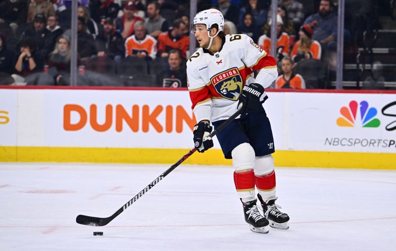 Mar 21, 2023; Philadelphia, Pennsylvania, USA; Florida Panthers defenseman Brandon Montour (62) controls the puck against the Philadelphia Flyers in the first period at Wells Fargo Center. Mandatory Credit: Kyle Ross-USA TODAY Sports