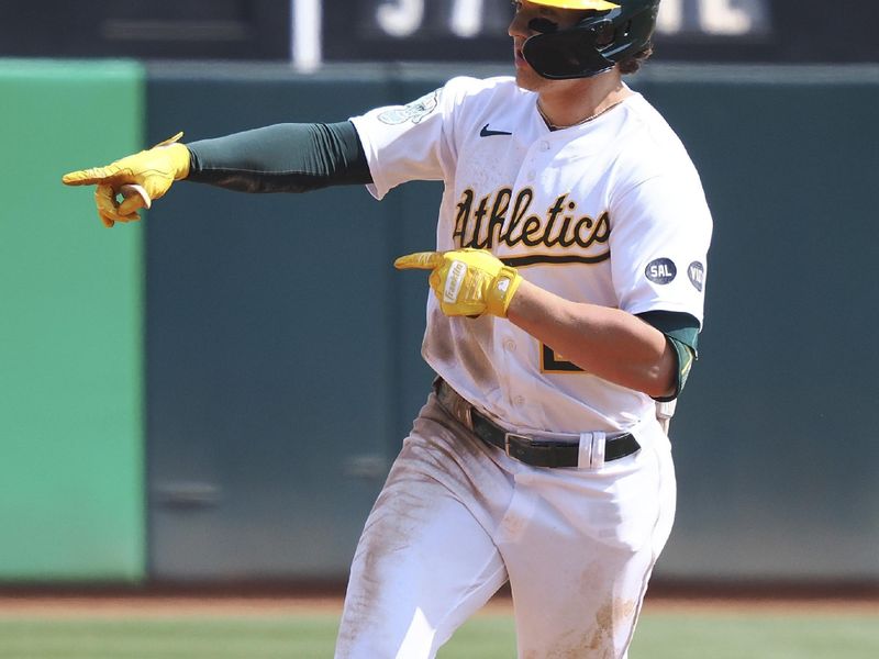 Sep 20, 2023; Oakland, California, USA; Oakland Athletics second baseman Zack Gelof (20) gestures to teammates as he rounds the bases on a solo home run against the Seattle Mariners during the fourth inning at Oakland-Alameda County Coliseum. Mandatory Credit: Kelley L Cox-USA TODAY Sports