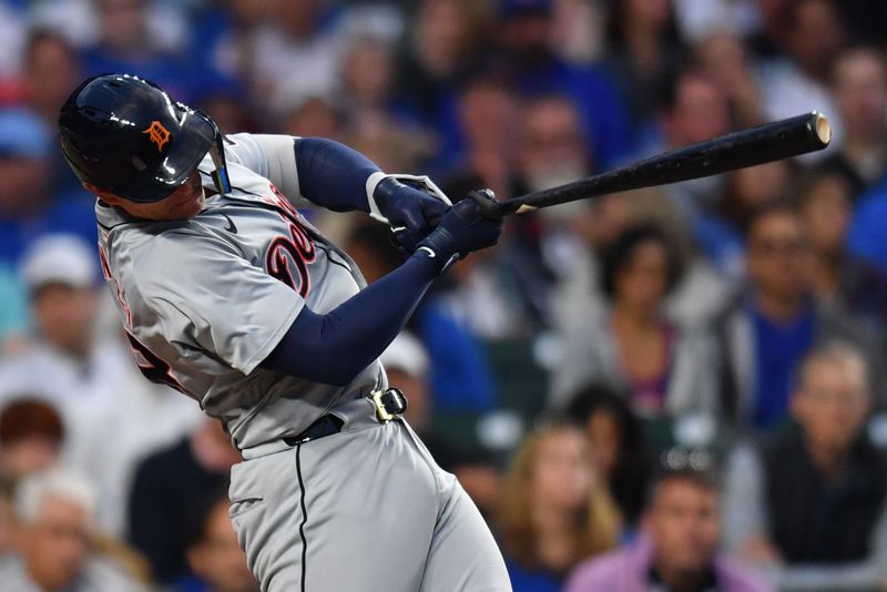 Aug 20, 2024; Chicago, Illinois, USA; Detroit Tigers catcher Dillon Dingler (38) hits an RBI single during the second inning against the Chicago Cubs at Wrigley Field. Mandatory Credit: Patrick Gorski-USA TODAY Sports